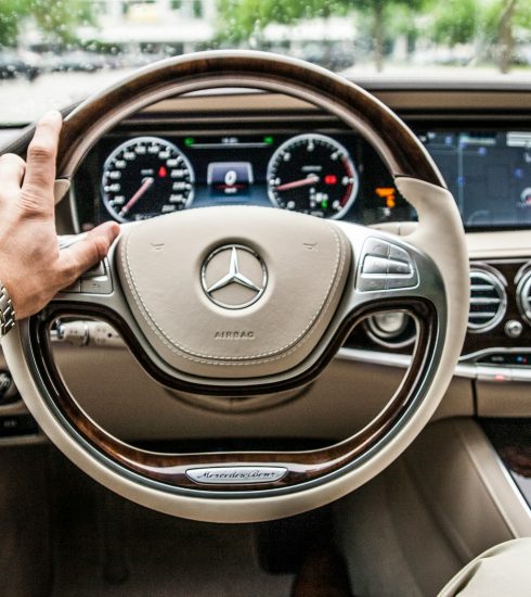 person sitting in Mercedes-Benz driver seat